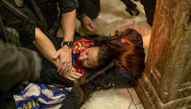Law enforcement entities claim that the woman was shot by Capitol Police. Once shot and fell on the floor of the Capitol, police gathered around her trying to save her while calling for help, rioters all gathered around the female filming and shouting