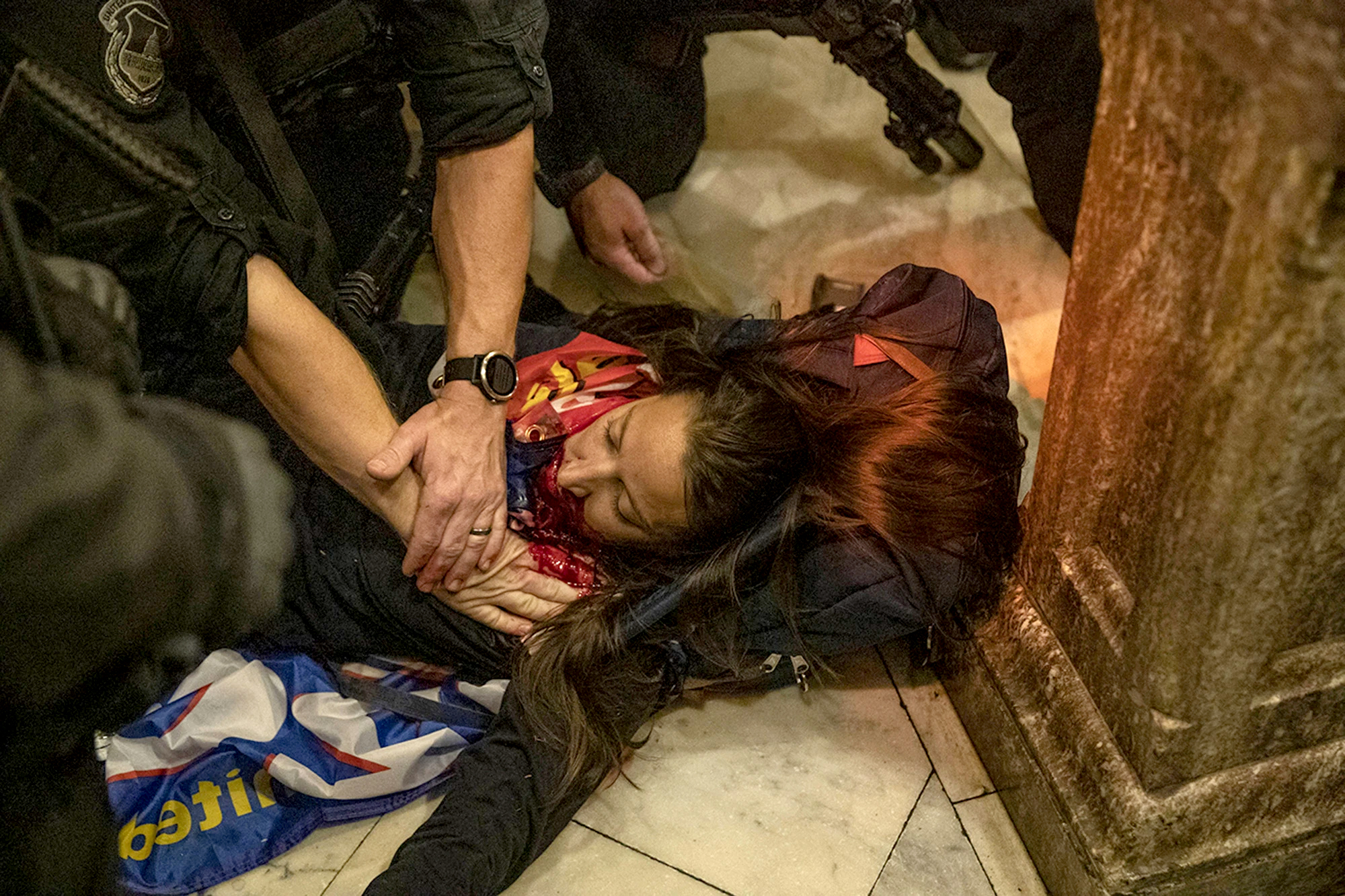 Law enforcement entities claim that the woman was shot by Capitol Police. Once shot and fell on the floor of the Capitol, police gathered around her trying to save her while calling for help, rioters all gathered around the female filming and shouting