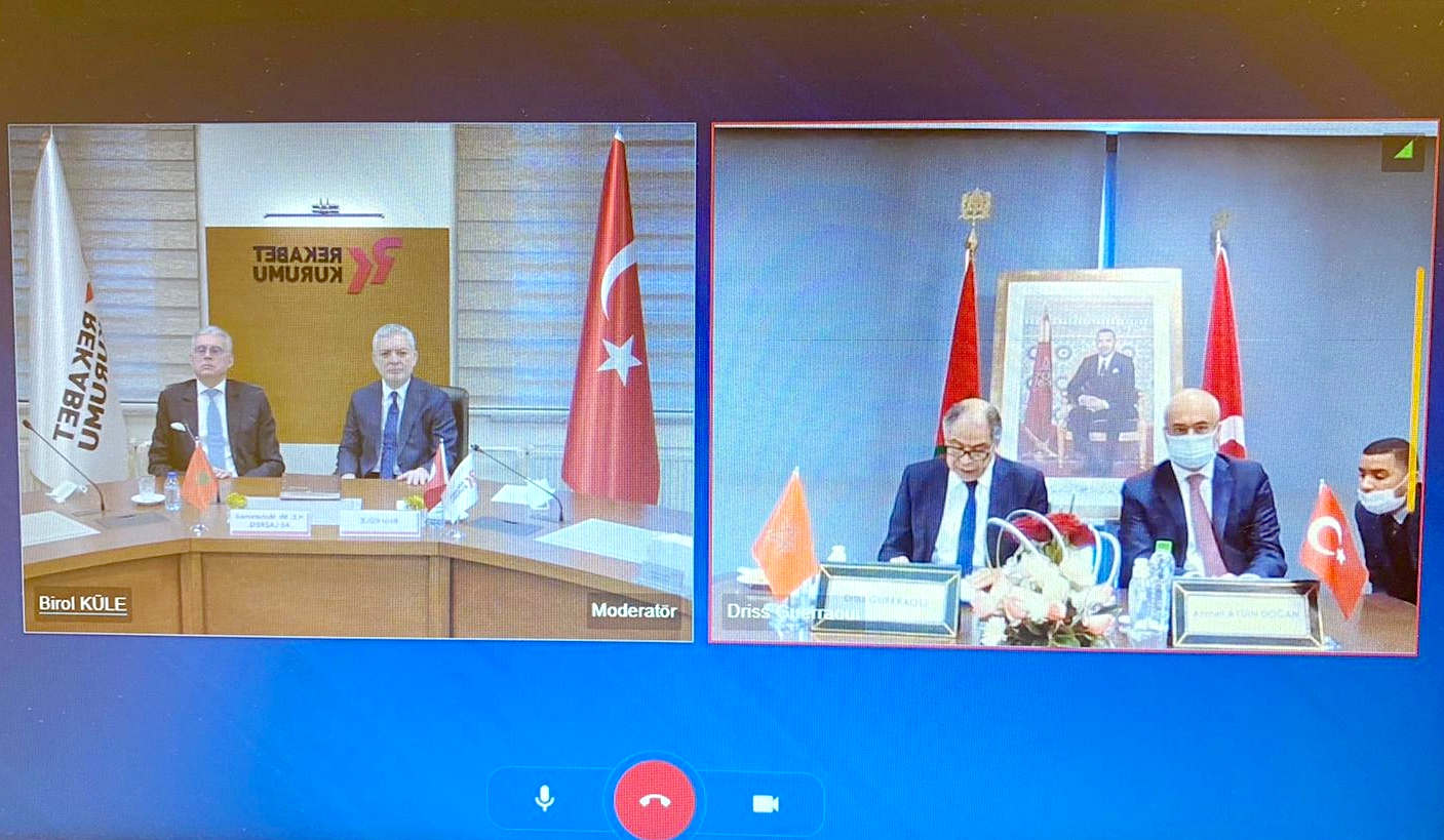 Morocco’s Competition Council President Driss Guerraoui and his Turkish counterpart Birol Kule signing the memorandum during video conference