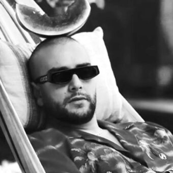 Moroccan rapper Draganove wearing dark sunglasses — artist and producer from Oujda