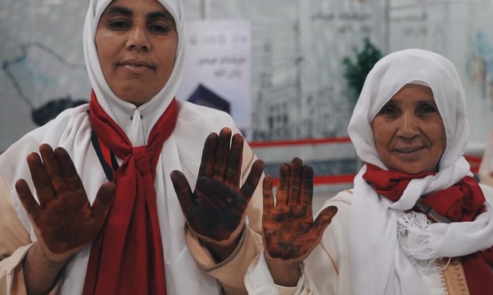 Moroccan female Hajj pilgrims having henna applied at Rabat-Salé Airport before departure to Makkah under the Makkah Route Initiative, May 2026