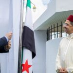 Syrian Foreign Minister Asaad al-Shaibani raises Syria’s flag at the embassy in Rabat alongside Moroccan Foreign Minister Nasser Bourita.