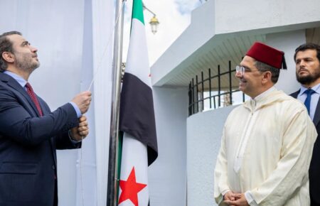 Syrian Foreign Minister Asaad al-Shaibani raises Syria’s flag at the embassy in Rabat alongside Moroccan Foreign Minister Nasser Bourita.
