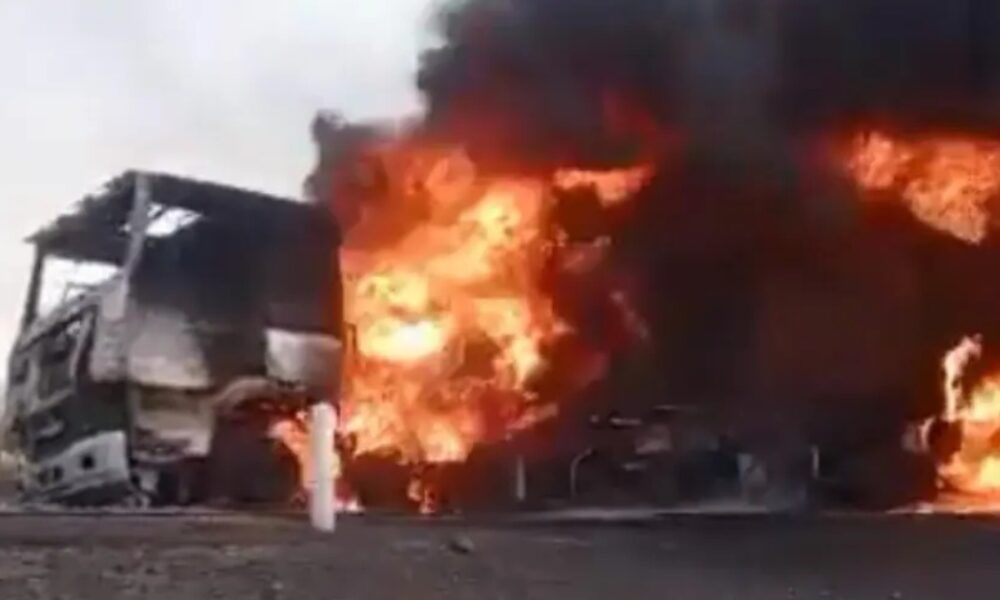 Burning Moroccan trucks on a highway in Mali after an armed attack