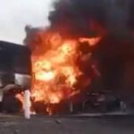 Burning Moroccan trucks on a highway in Mali after an armed attack