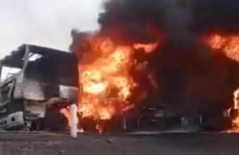 Burning Moroccan trucks on a highway in Mali after an armed attack