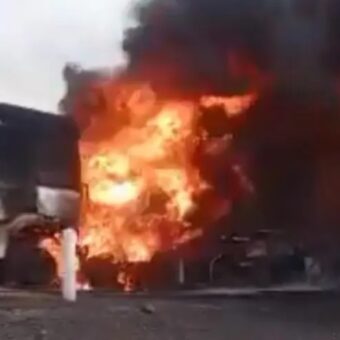 Burning Moroccan trucks on a highway in Mali after an armed attack