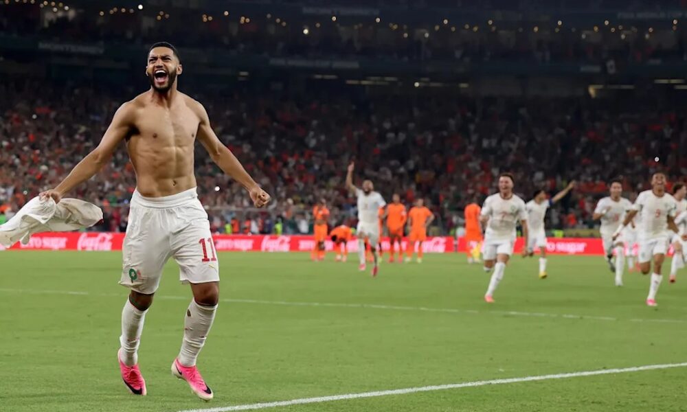 Morocco players celebrate after defeating the Netherlands.