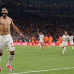 Morocco players celebrate after defeating the Netherlands.