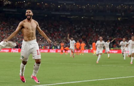 Morocco players celebrate after defeating the Netherlands.