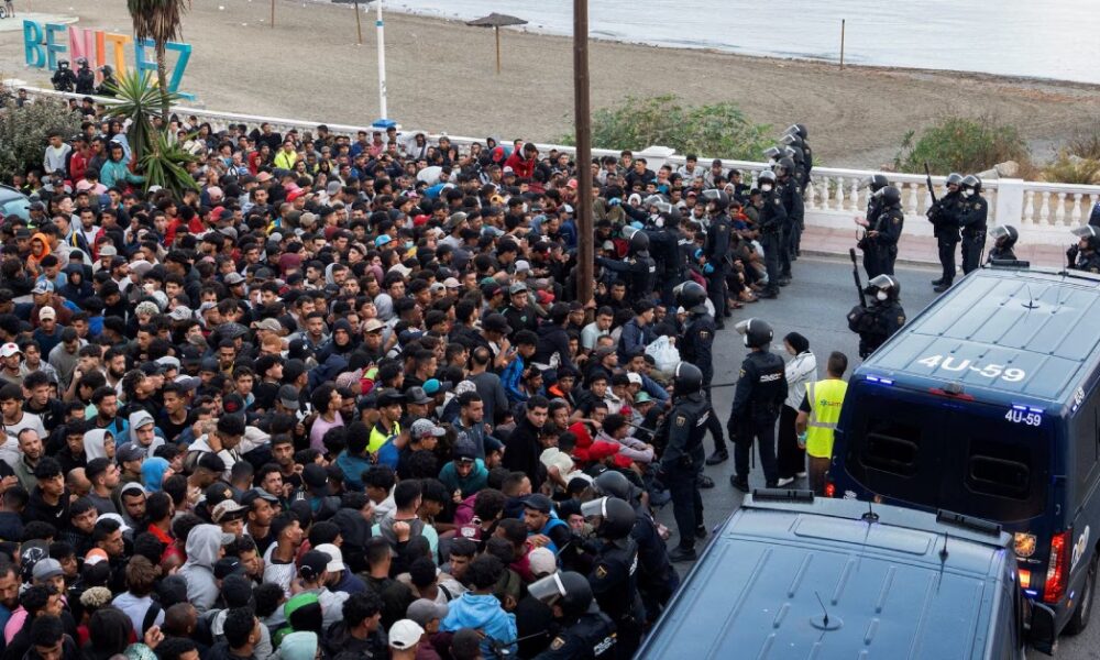 Police clear migrants from beaches in Occupied Ceuta as shelter remains limited.