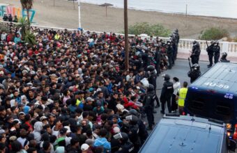 Police clear migrants from beaches in Occupied Ceuta as shelter remains limited.